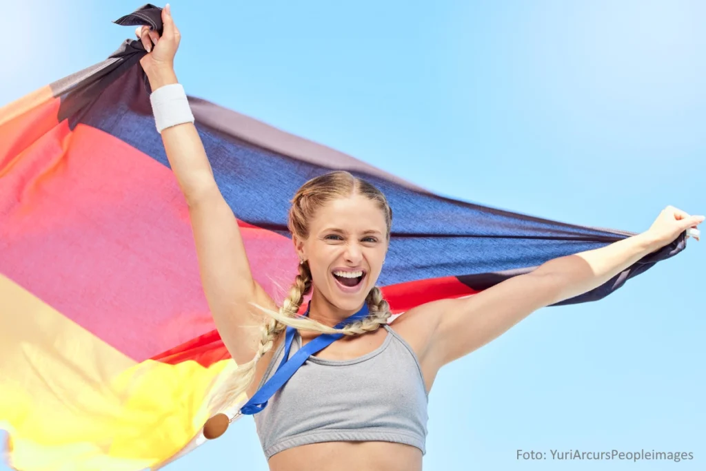 Junge Athletin mit Deutschlandflagge